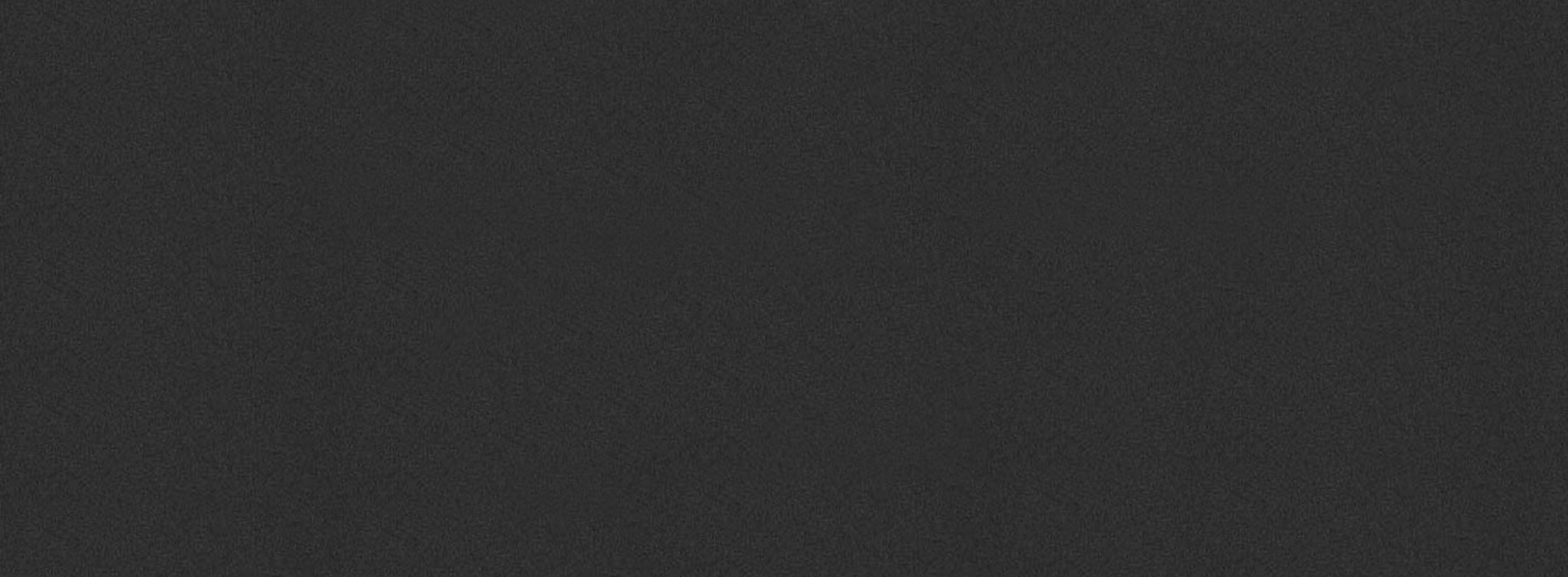 The image displays a plain, dark gray background with a lighter gray gradient on the right side.